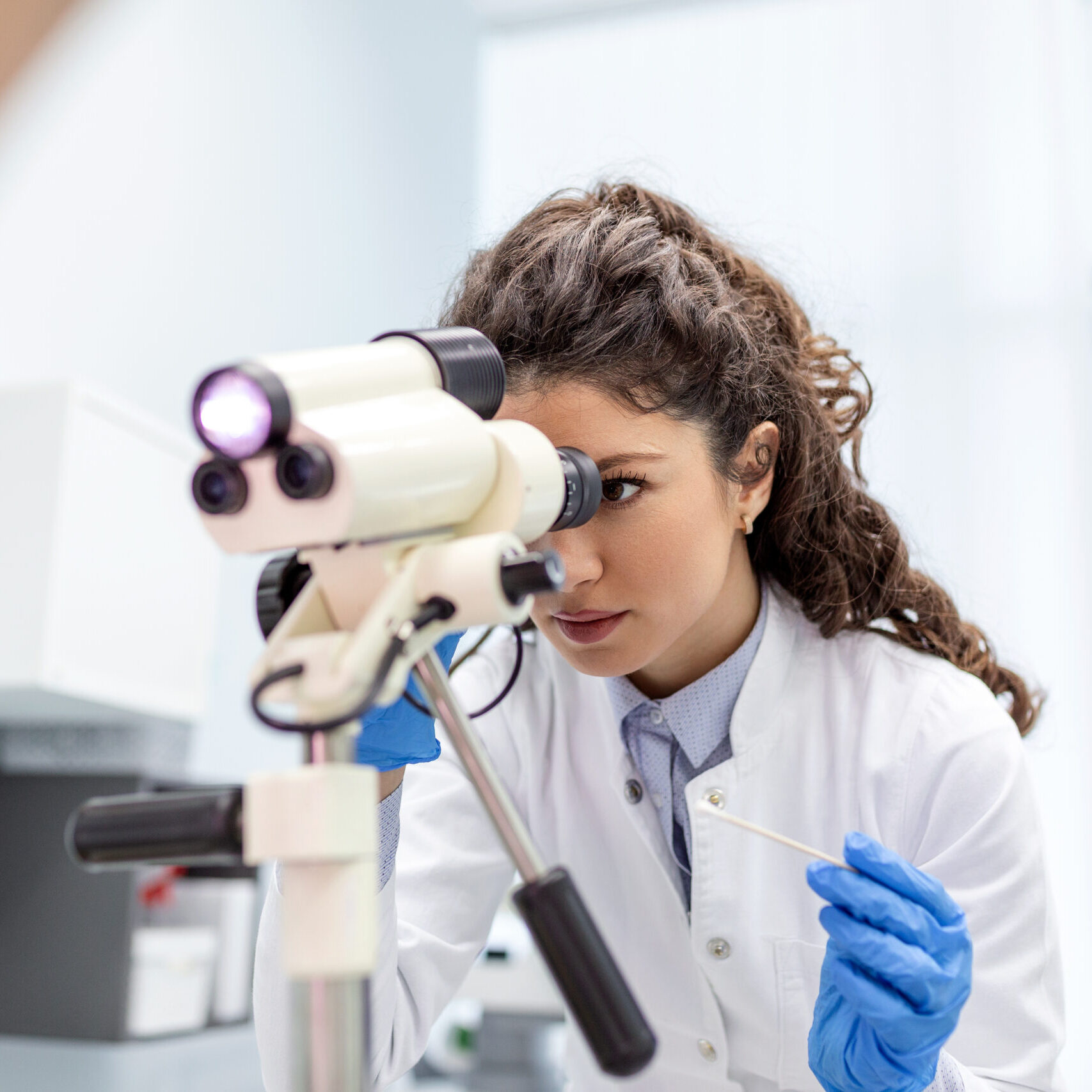 colposcope close-up, image of a gynecologist and a patient in a gynecological chair. Women's consultation