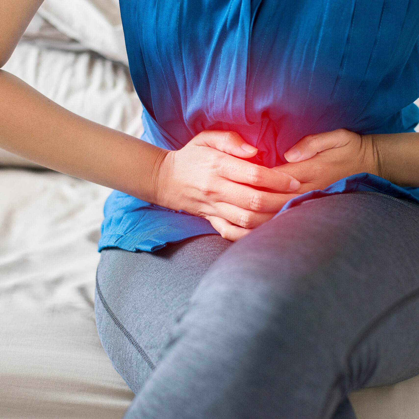 Woman having painful stomachache,Female suffering from abdominal pain,Period cramps,Close up