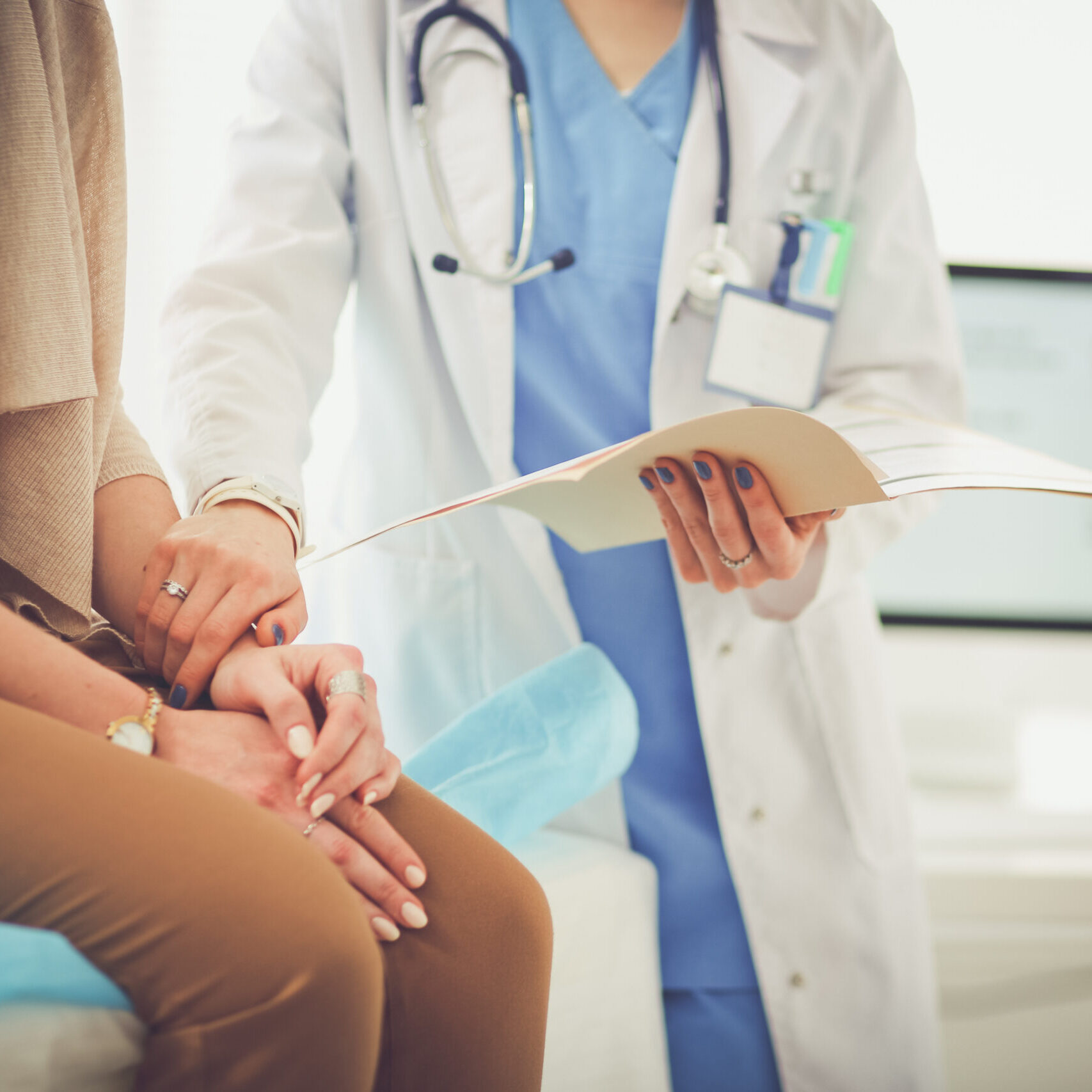 Doctor and patient discussing something while sitting at the table . Medicine and health care concept. Doctor and patient.