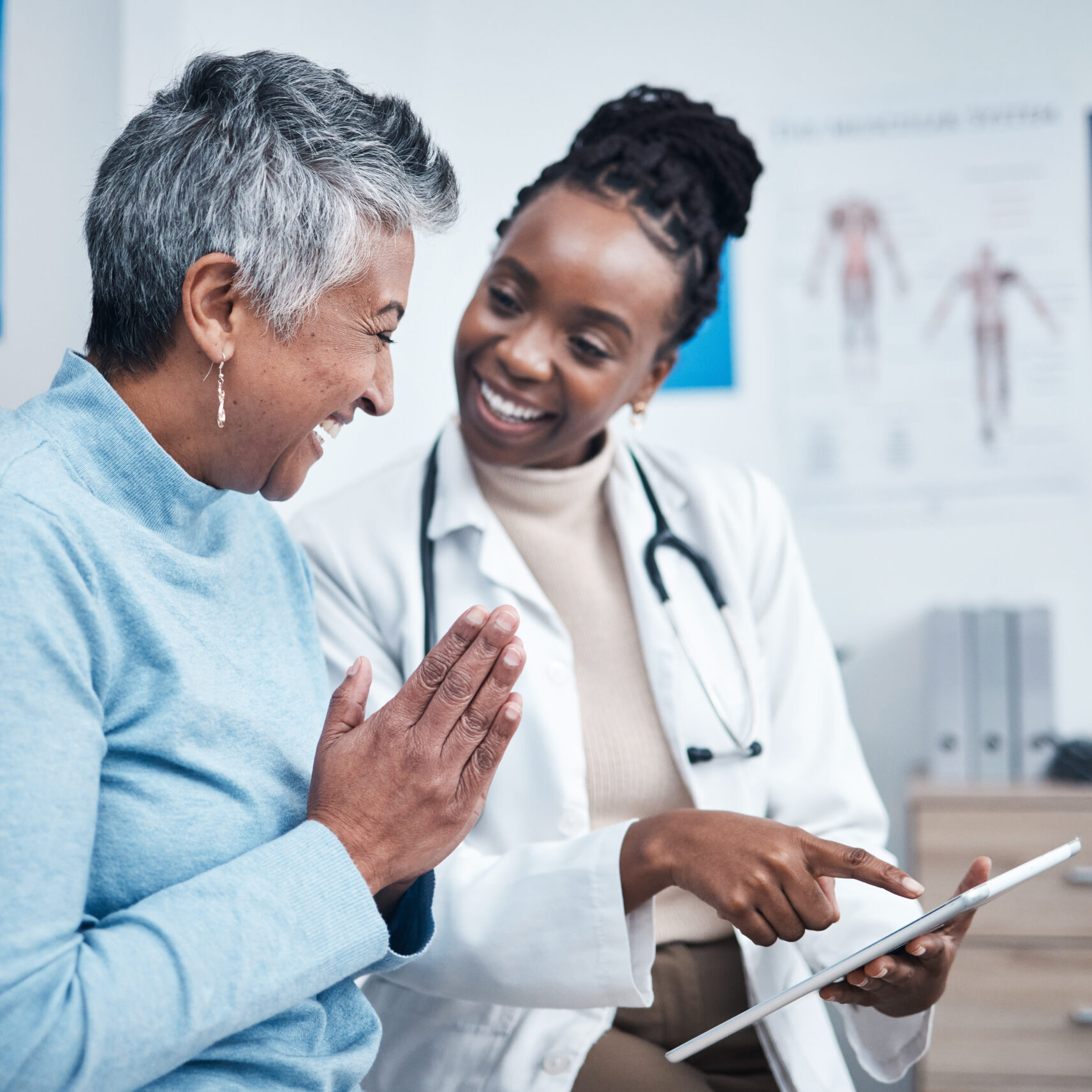 Black woman, doctor and elderly patient with good news, tablet and results for health, advice and report. Happy african medic, mobile touchscreen or healthcare with smile, tech or support in hospital.