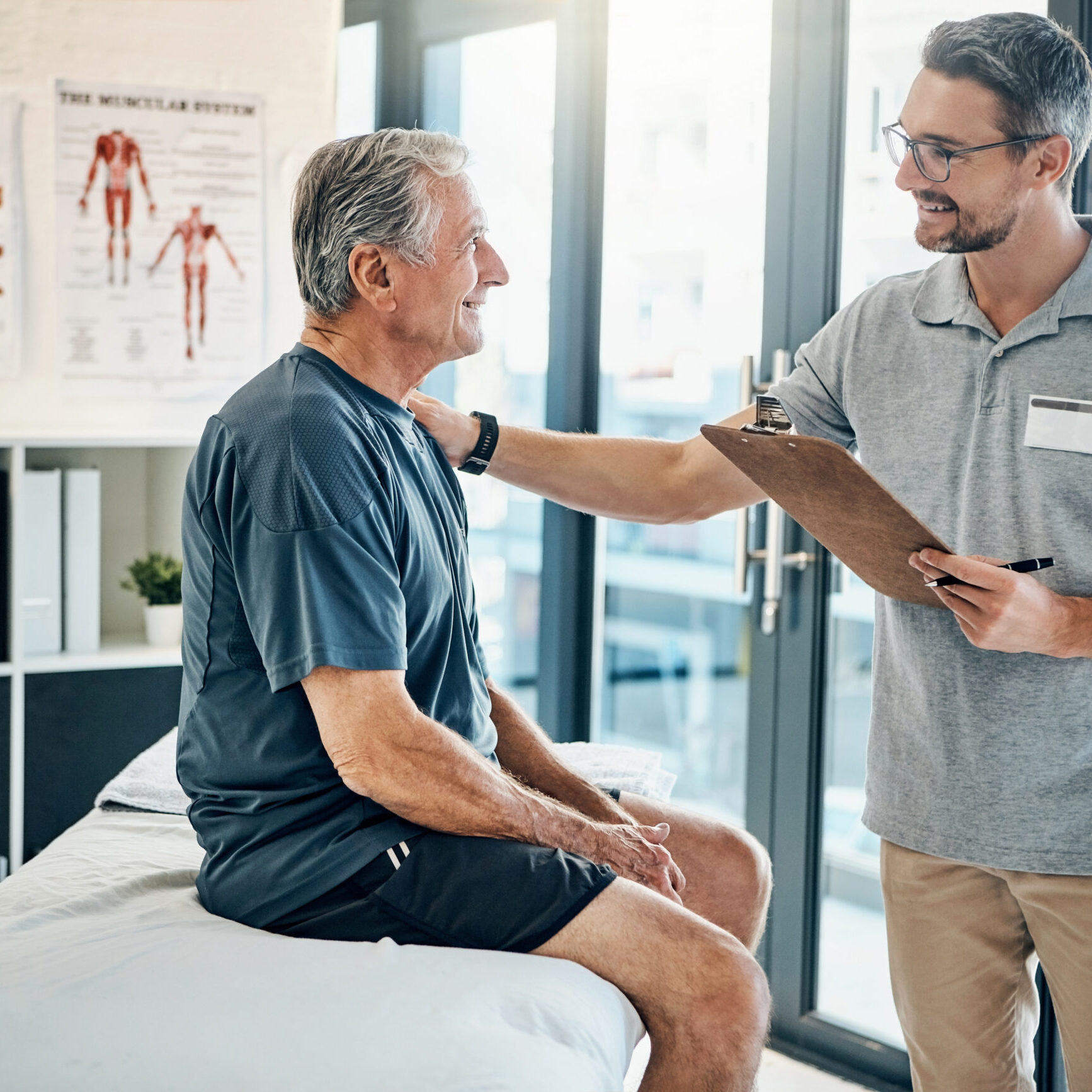 Physiotherapy, clipboard and senior patient consulting for rehabilitation, recovery and treatment. Healthcare, physical therapy and chiropractor with old man for medical service, wellness and results.